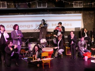 An ensemble plays a mix of instruments.
